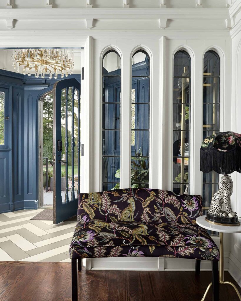 Entry way with blue door and animal print seating