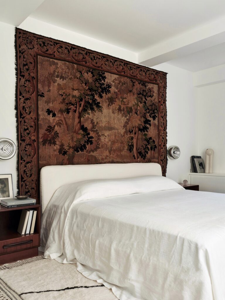Bedroom with statement art behind the bed