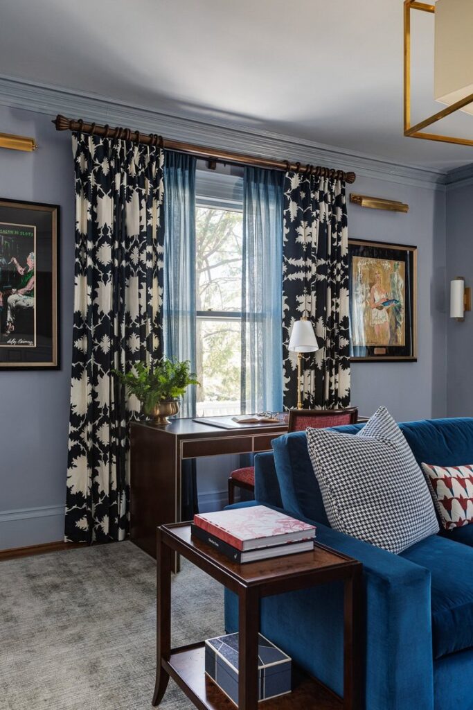 Home office with desk facing window