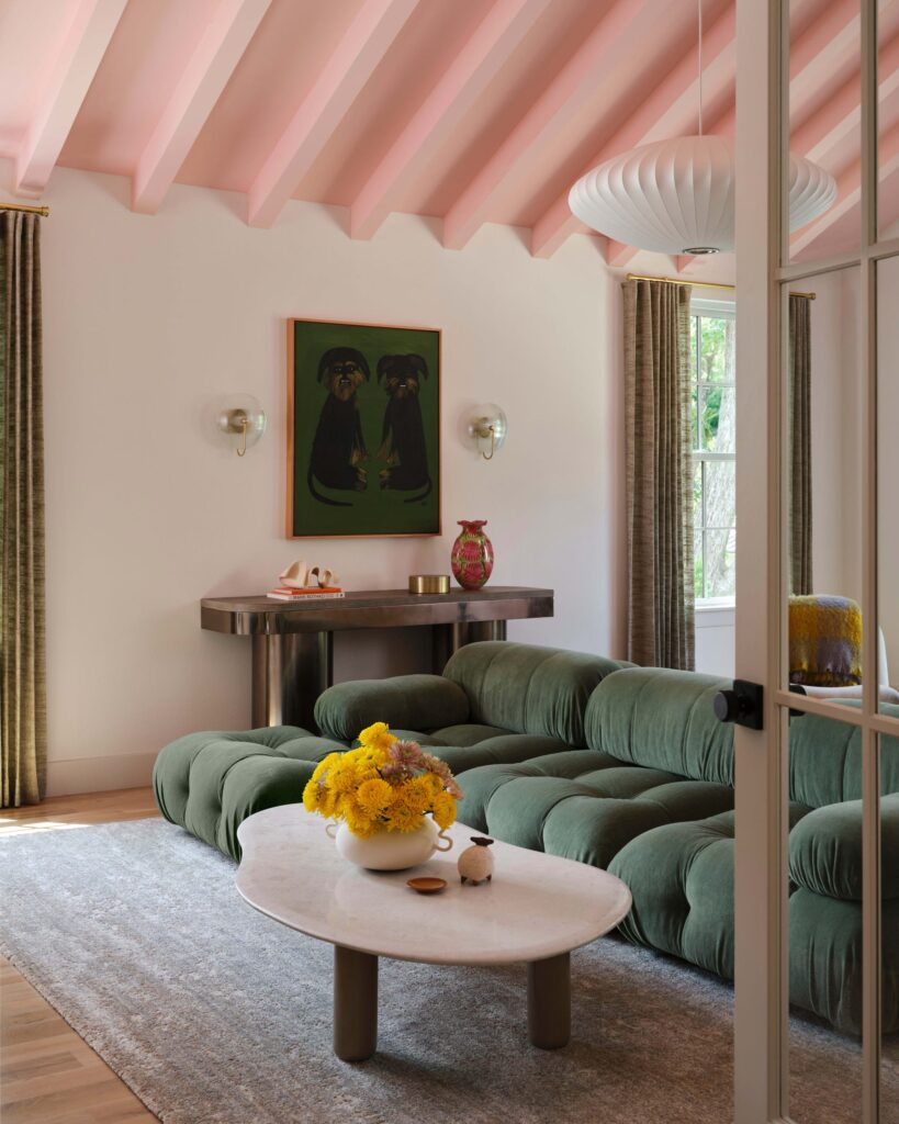 olive green couch and dusty pink ceiling
