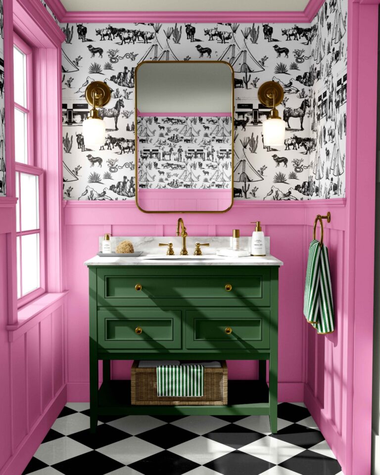 Katie Kime destination themed wall coverings in a pink, black, and white bathroom