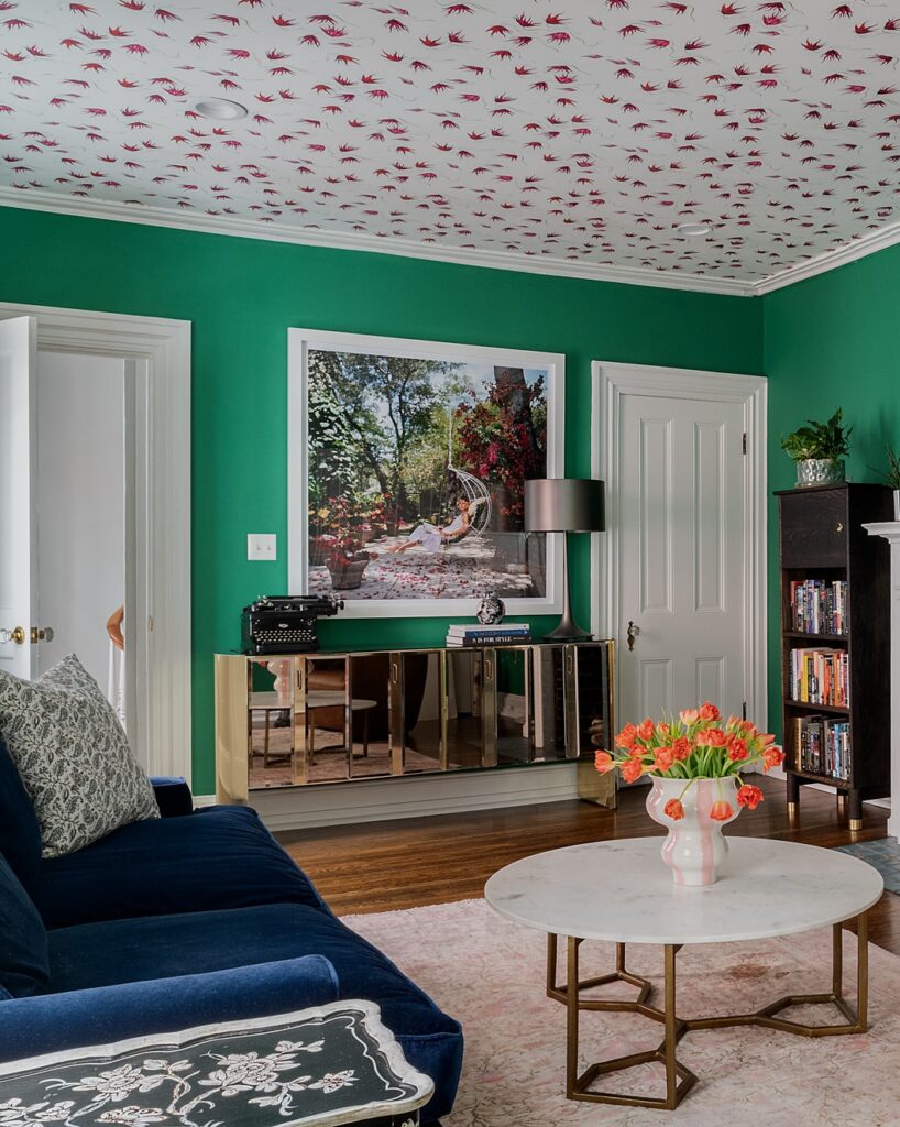 green walls and floral wallpapered ceiling