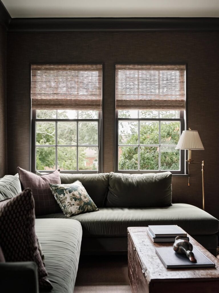 L-shaped couch next to a window