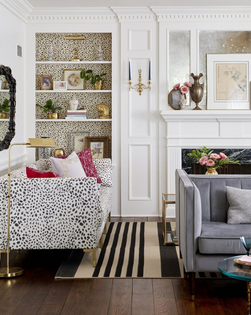 wallpapered bookshelf in living room