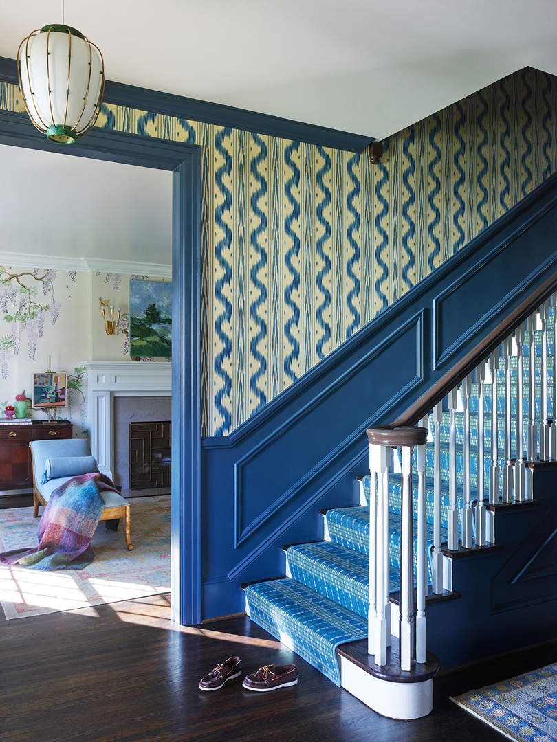 Indigo trim and chartreuse wallpaper stairs