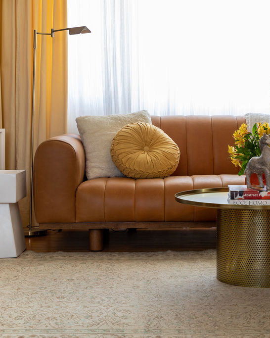 mustard curtains and cognac couch