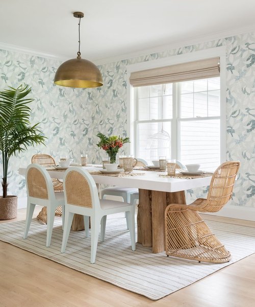 white and neutral dining room with light blue floral wallpaper