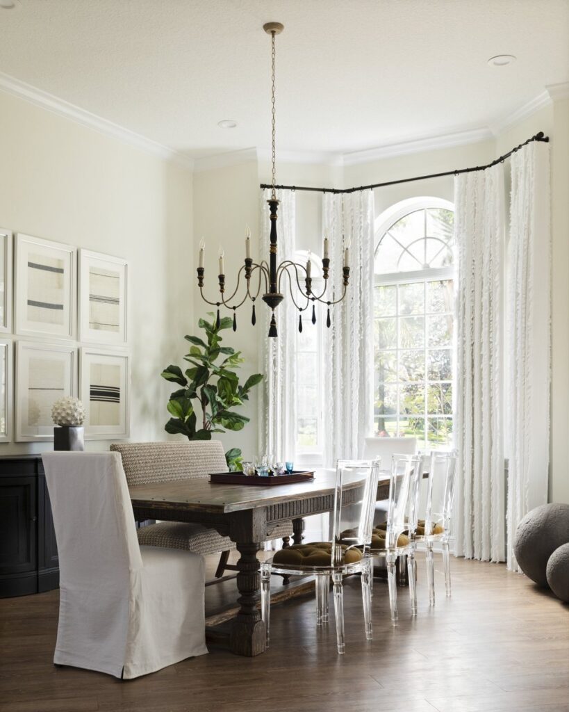 traditional dining room with modern acrylic chairs