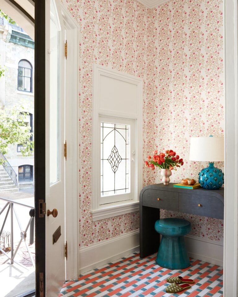 red floral wallpaper entryway