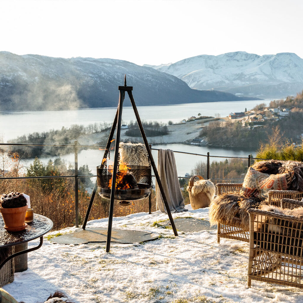 Outdoor fire pit sitting area at the Storfjord Hotel