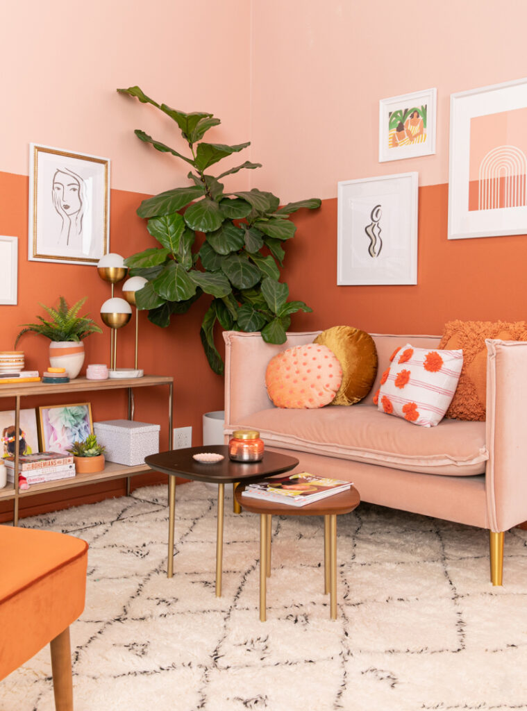 salmon colored couch with rust and salmon colored painted walls