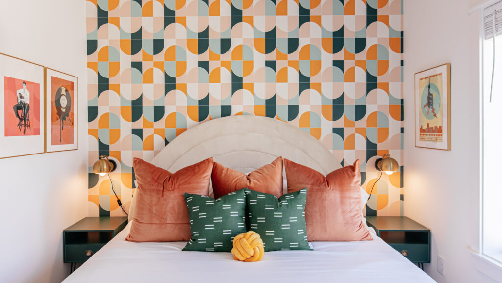 colorful wallpaper behind bed