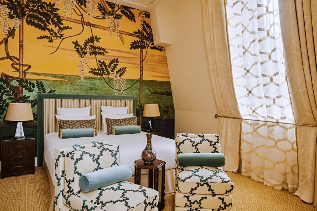 Yellow and green plant motif wallpaper in guest room at the Saint James in Paris, France