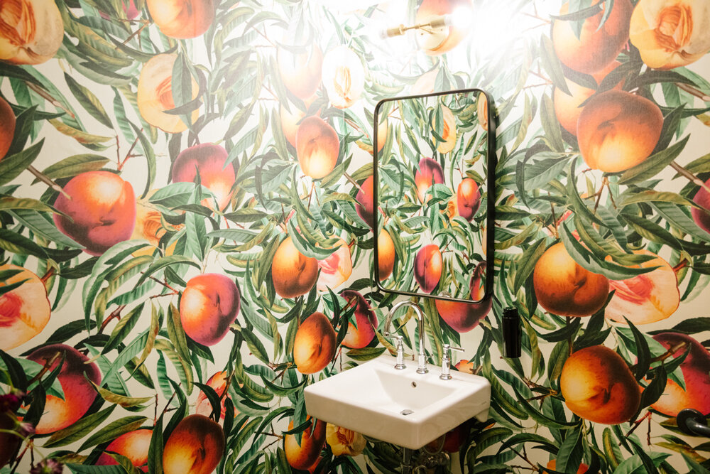 Fruit wallpapered bathroom at Hotel Clermont in Atlanta, Georgia