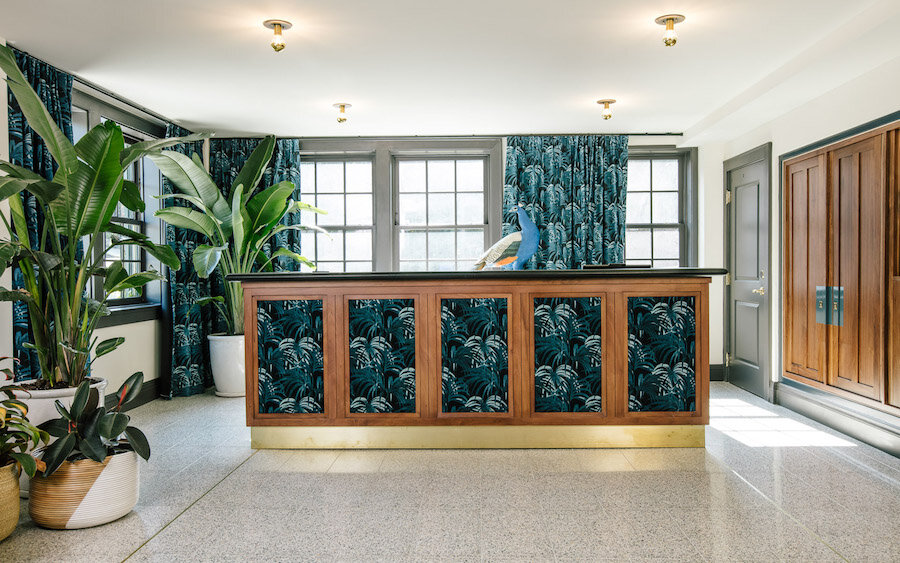 Wallpapered front desk at Hotel Clermont in Atlanta, Georgia