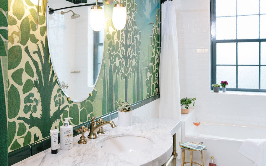 Green wallpapered bathroom at Hotel Clermont in Atlanta, Georgia