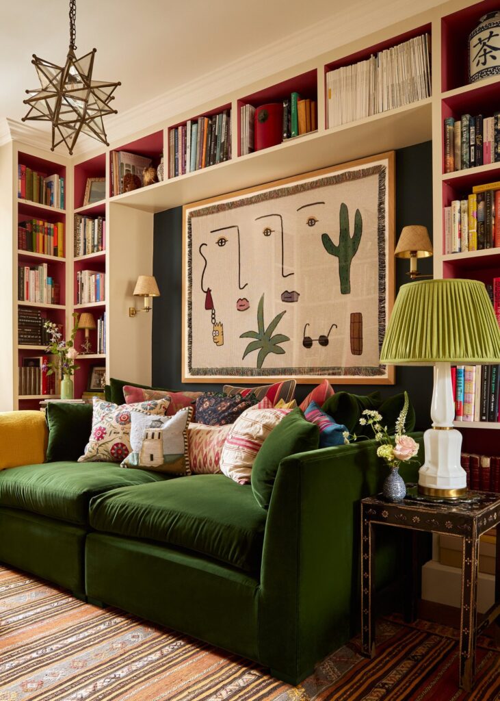 green couch in a living room with layered colors and patterns