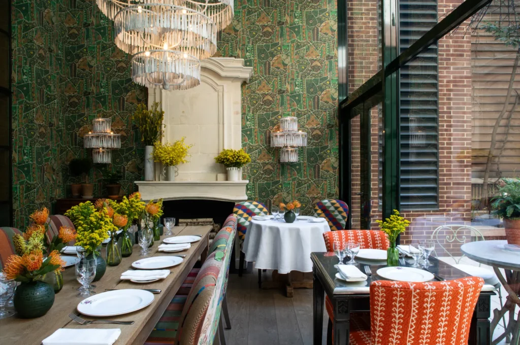 Green wallpapered restaurant at The Crosby Hotel in New York City