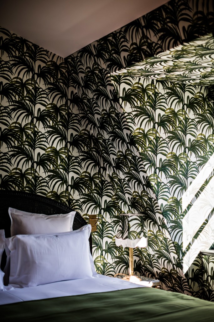 Green leaf motif wallpaper in a guest room at Hôtel Providence in Paris, France