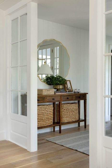 Simple white vestibule with side table